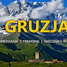 Górzysty krajobraz Gruzji, z majestatycznymi szczytami i kamienną wieżą, zachęca do odkrywania, czy Gruzja jest w Europie.